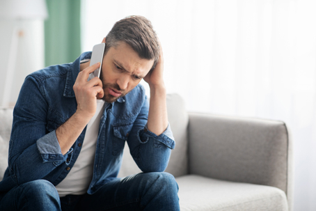 Worried man on the phone