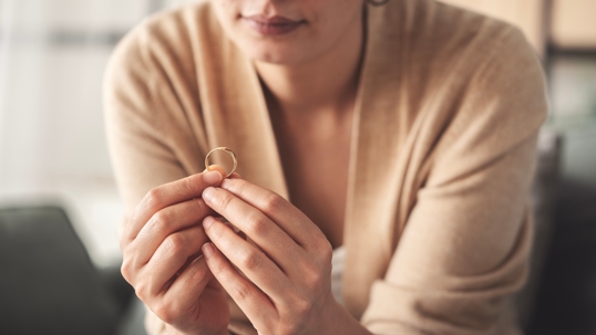 Wife looking at wedding ring
