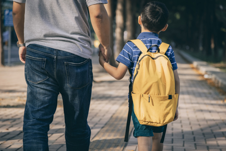 Parent accompanying child to school highlighting access to school information