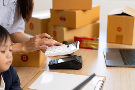 Parent calculating expenses at home related to child support payments