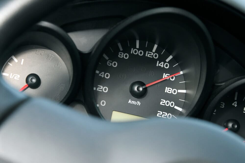 A speedometer showing a seed of 160mph, which is reckless driving.
